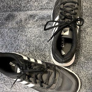 Black and white tennis shoes, Adidas men.